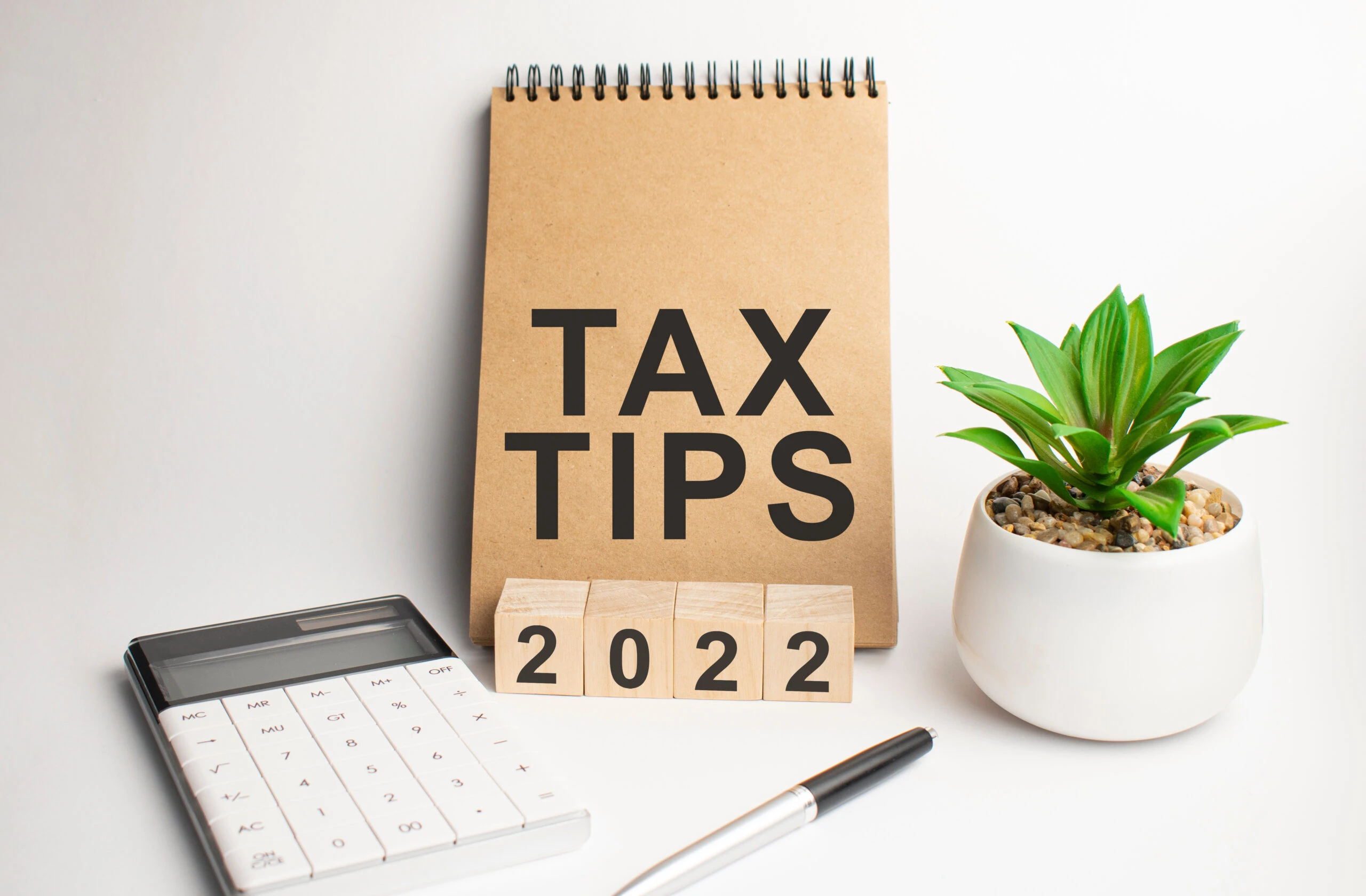 TAX TIPS on paper notepad on office work place 2022 Tax Tips Small Business Hechtman Group Northbrook Chicago IL CPA Accountant
